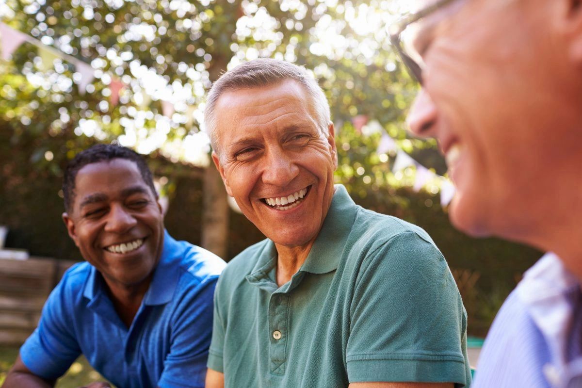 Friends laughing together outdoors